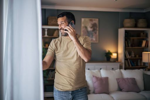 man on phone calling for furnace repair services in detroit mi