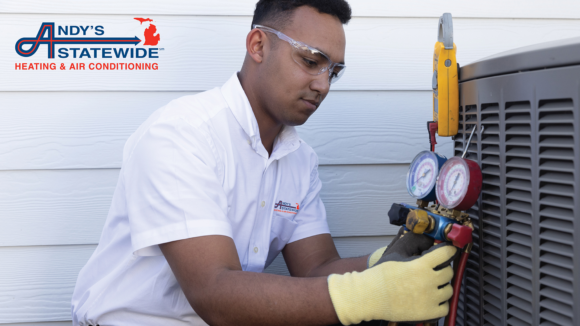 Andys Statewide technician repairing air conditioning unit in Detroit MI.